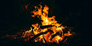 A campfire in the dark.